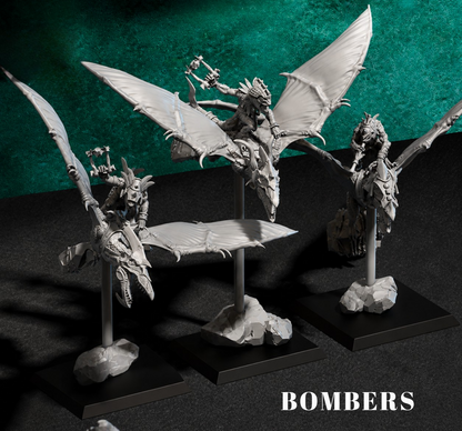 Model figures on stands with 'BOMBERS' text against a dark background